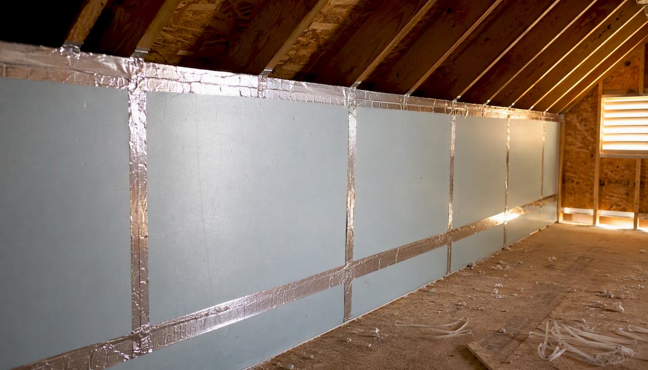 Taped rigid foam board seams on knee wall