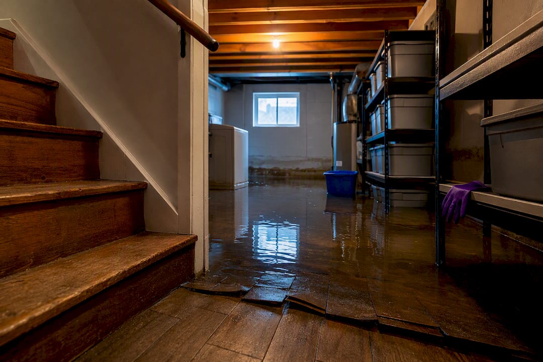 Flooded basement with damaged belongings