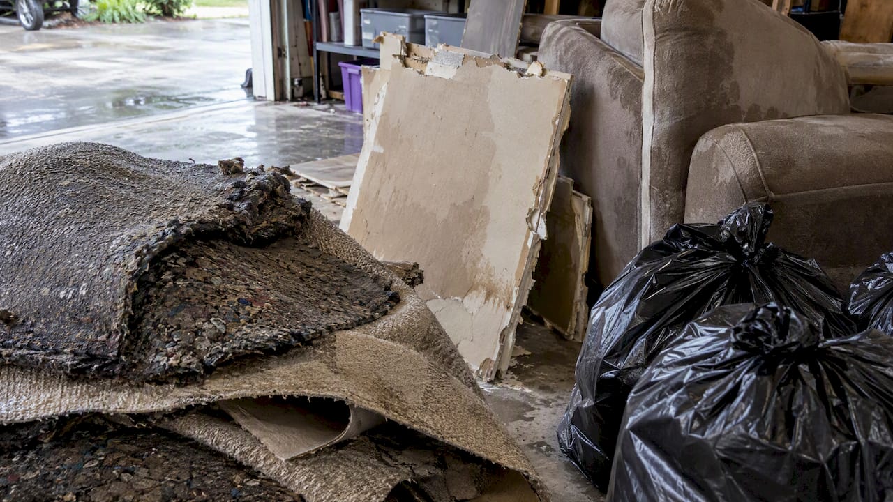 Water damaged carpet padding for disposal